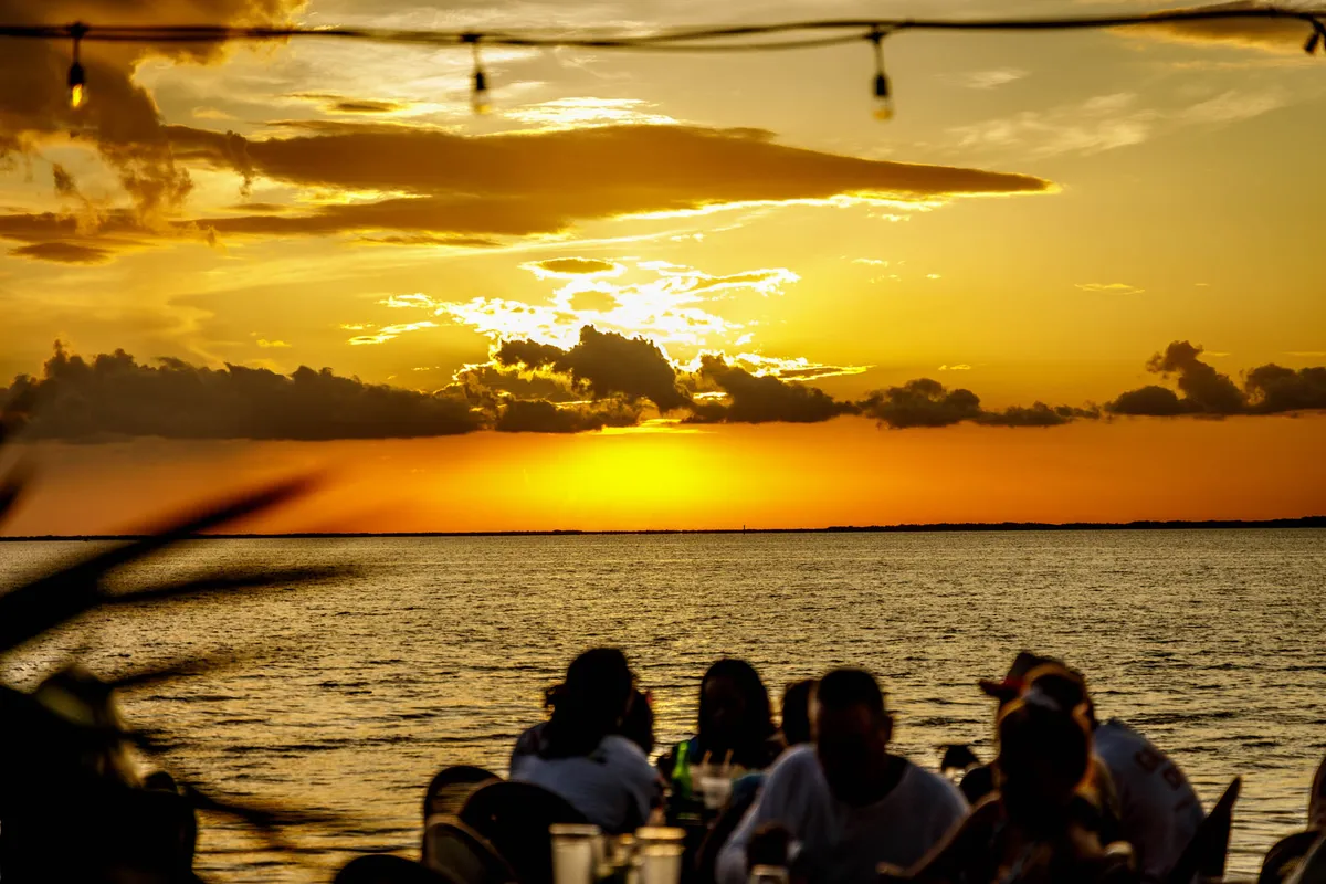 Guests watching the sunset over Florida Bay at Sundowners